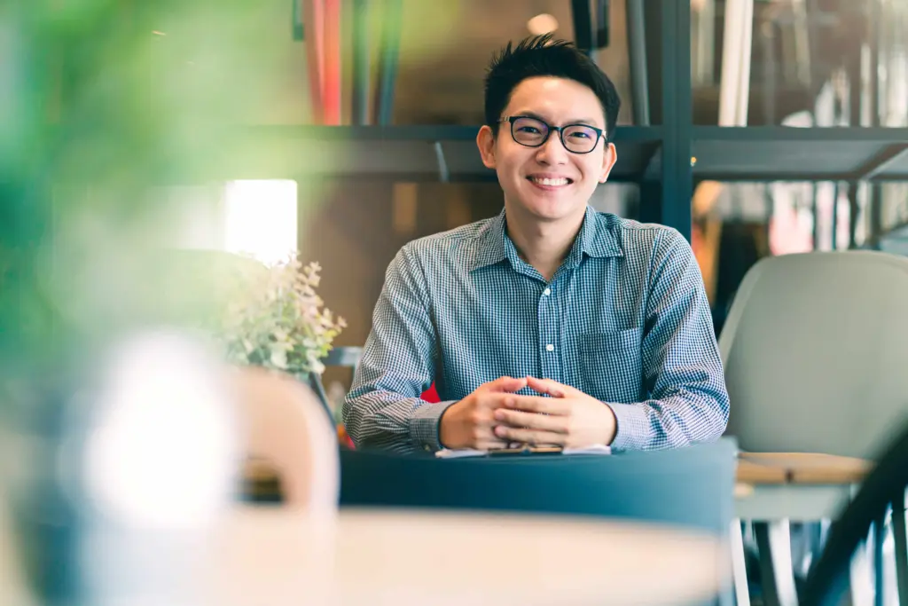 asian businessman startup company entrepreneur sit smile with happiness new shop store office background business ideas concept (1)