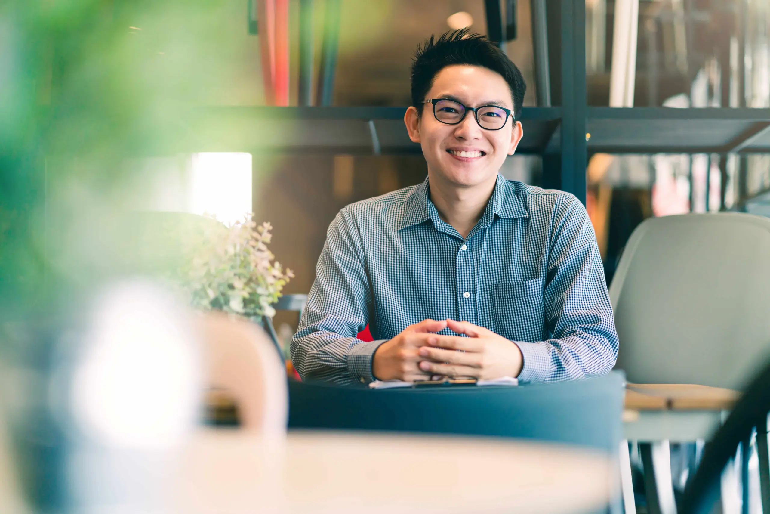 asian businessman startup company entrepreneur sit smile with happiness new shop store office background business ideas concept (1)