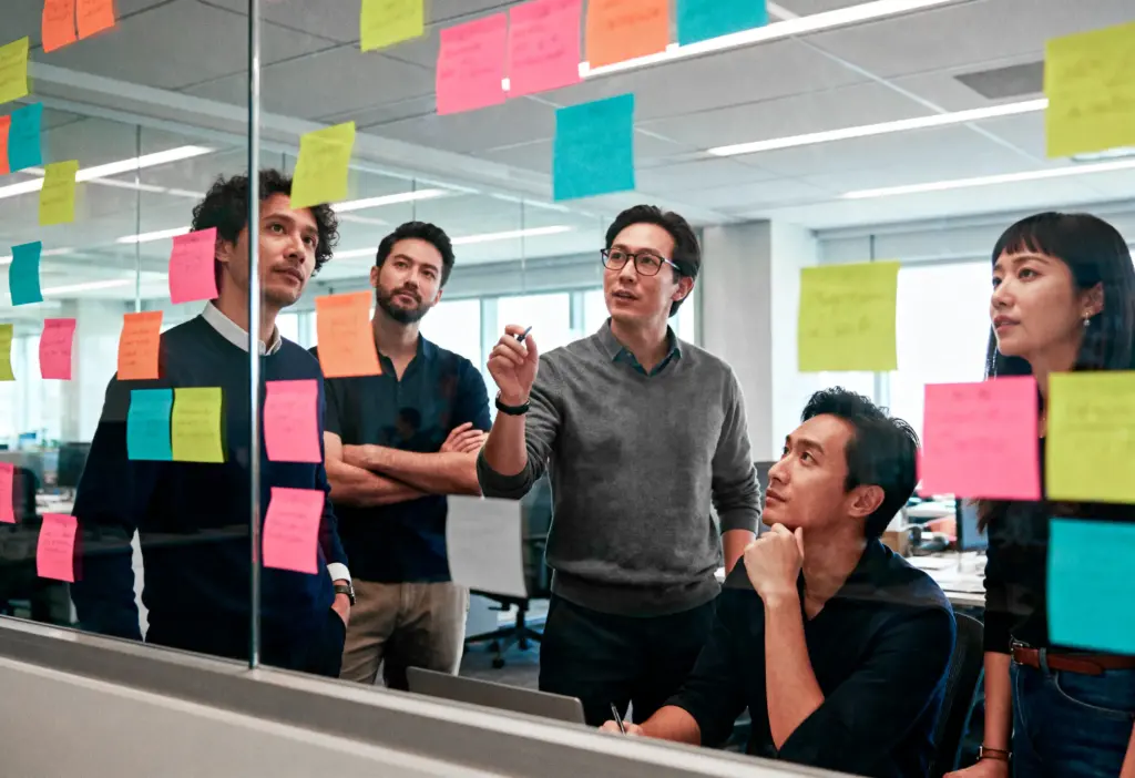 brainstorming session with sticky notes glass (1)