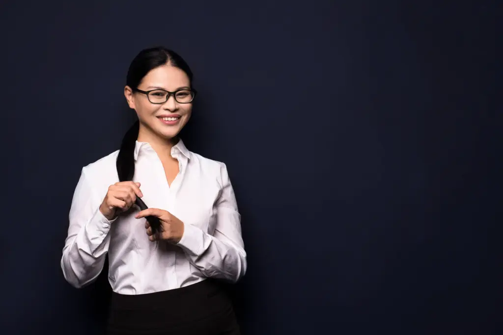 brunette businesswoman standing dark background (1)