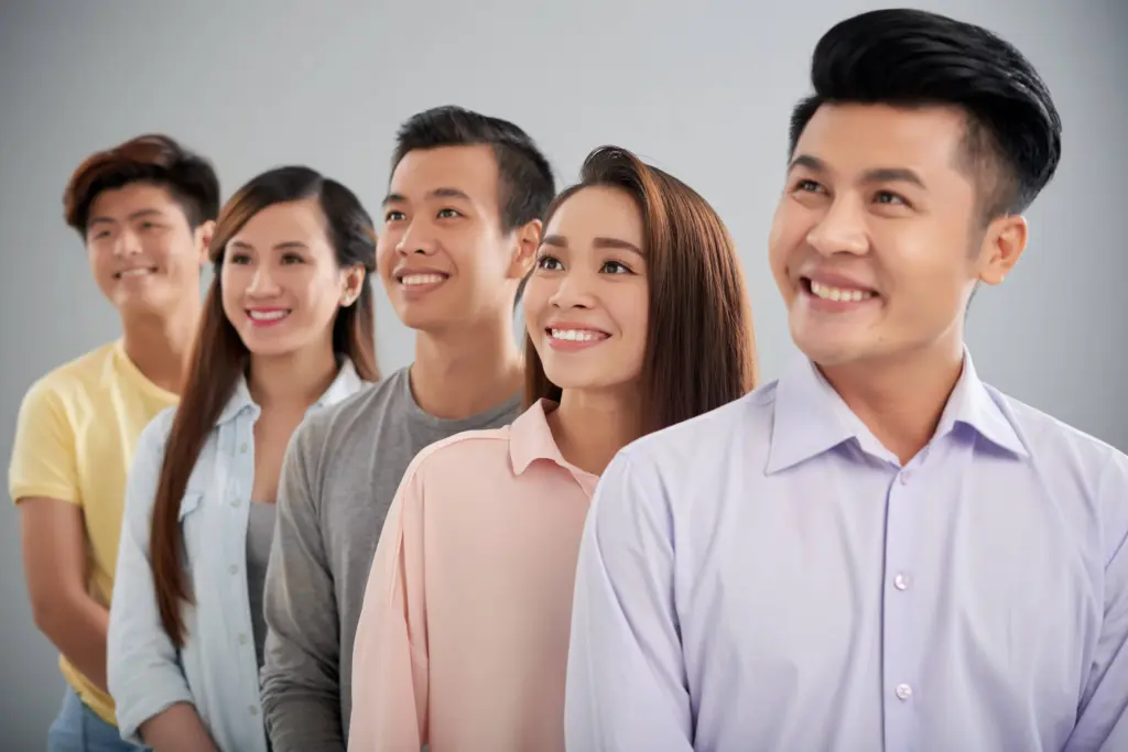 five young people standing row looking sideways (1)