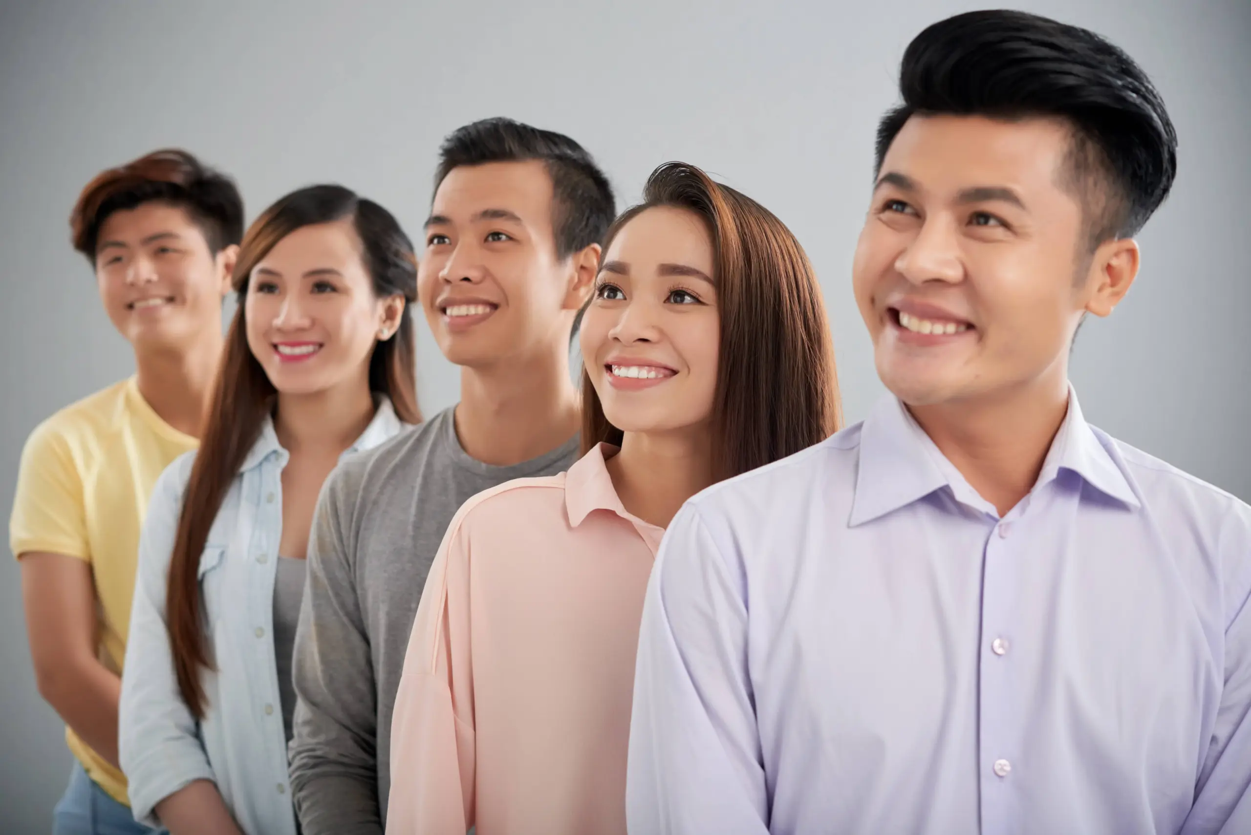 five young people standing row looking sideways (1)