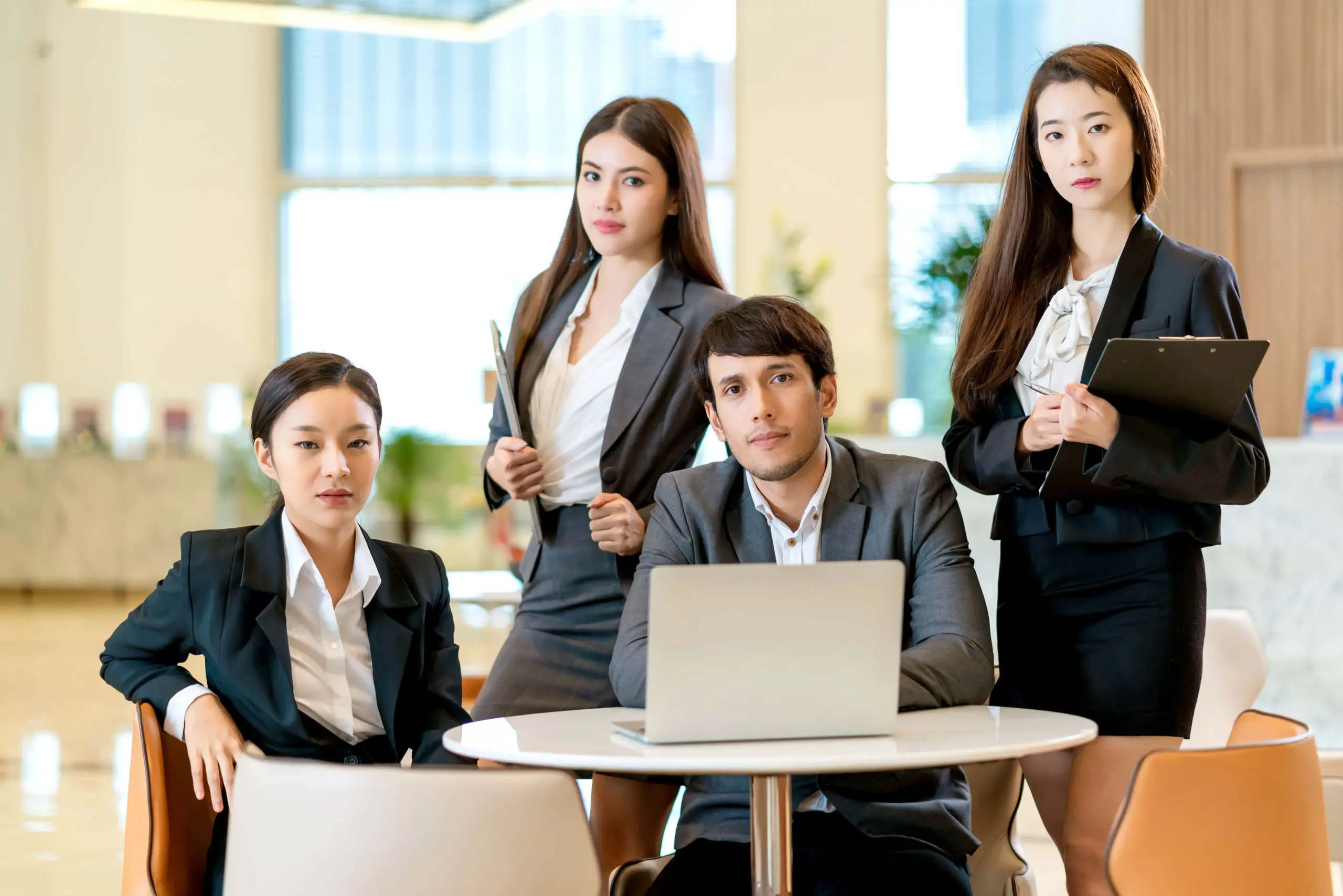 group smart business asian teamwork business uniform look camera with confident cheerful with modern design office background (1)