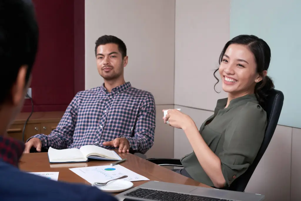 portrait cheerful business lady having coffee meeting (1)