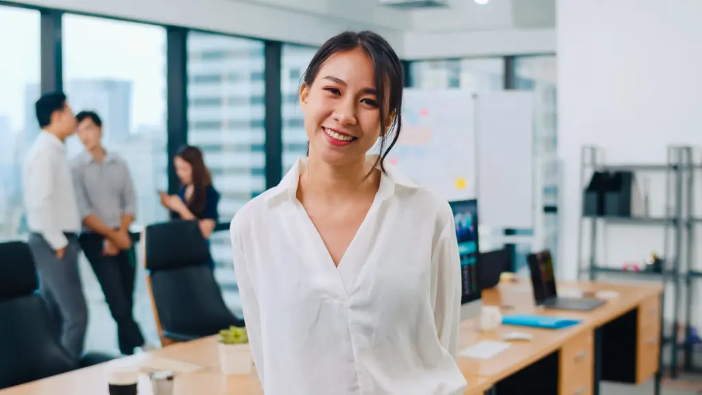 portrait successful beautiful executive businesswoman smart casual wear looking camera smiling modern office workplace young asia lady standing contemporary meeting room (1)