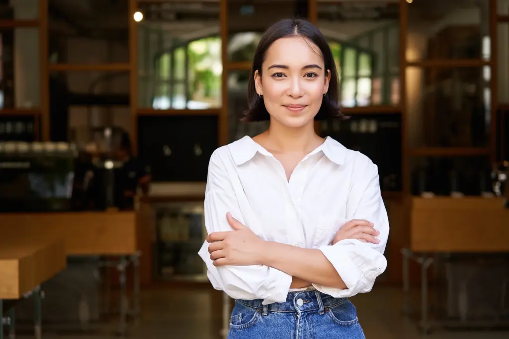 portrait young female entrepreneur asian business owner manager sitting confident smiling c (1)