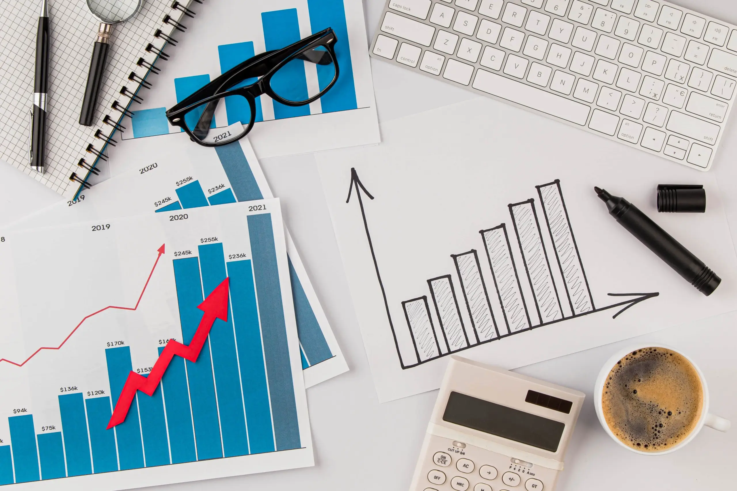 top view office desk with growth chart glasses (1)