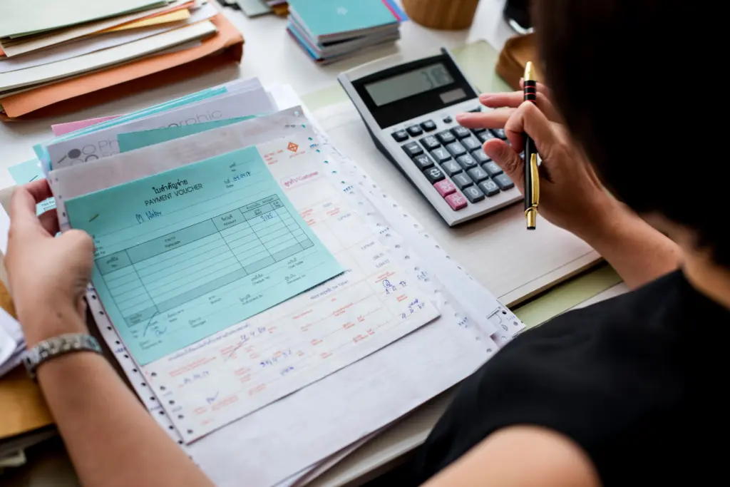 asian woman working through paperwork (1)