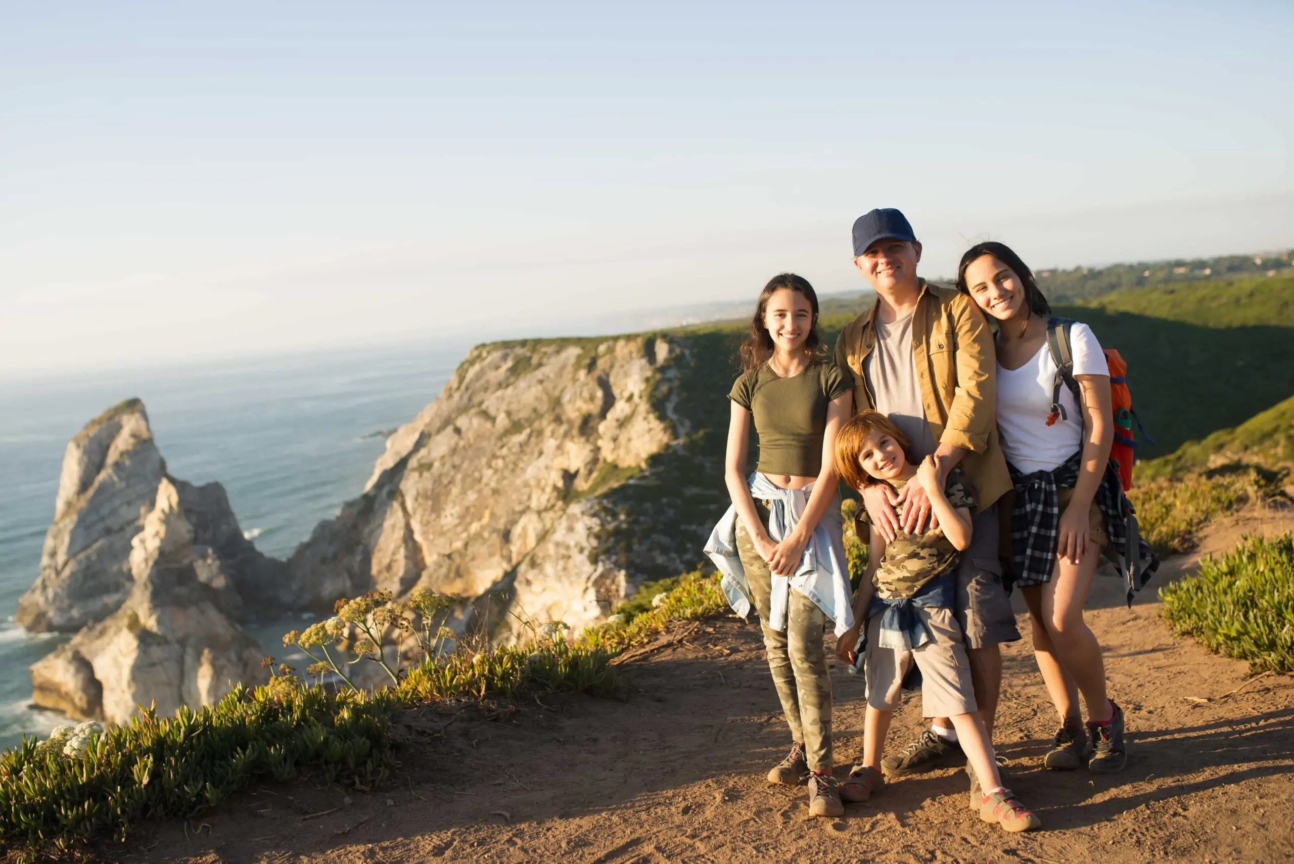 happy father hiking with children mountains (1)