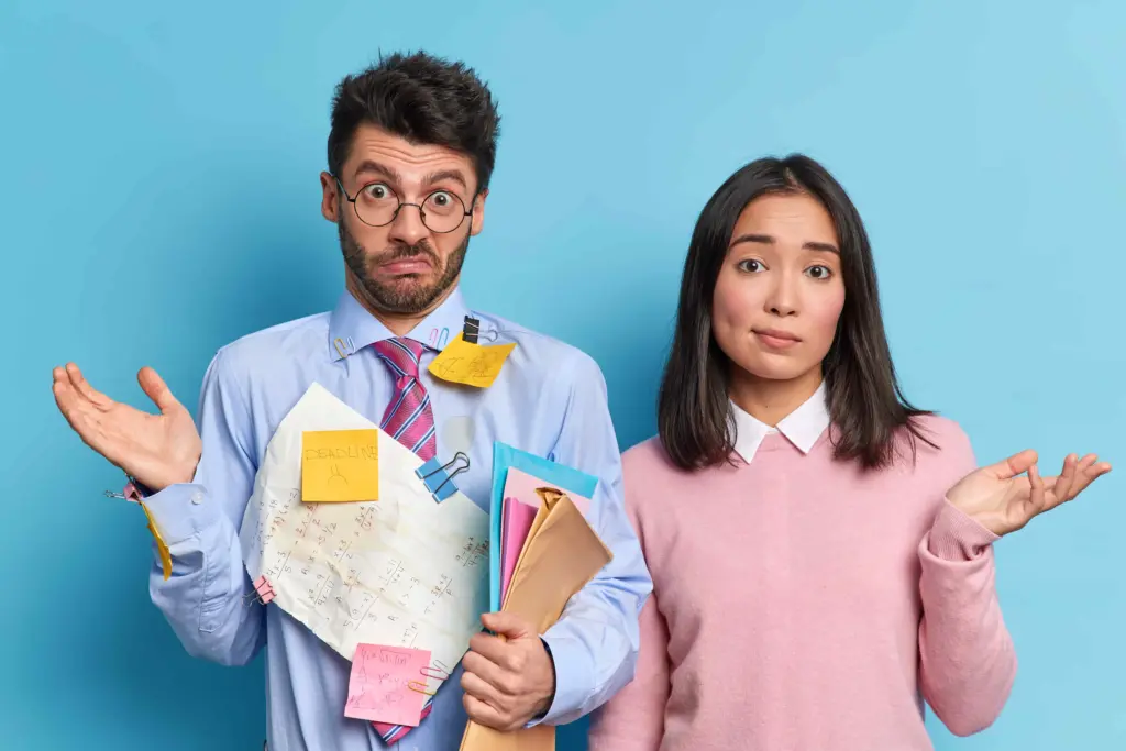 hesitant coworkers shrug shoulders collaborate making common task unaware clueless students dont know how prepare project work successfully (1)
