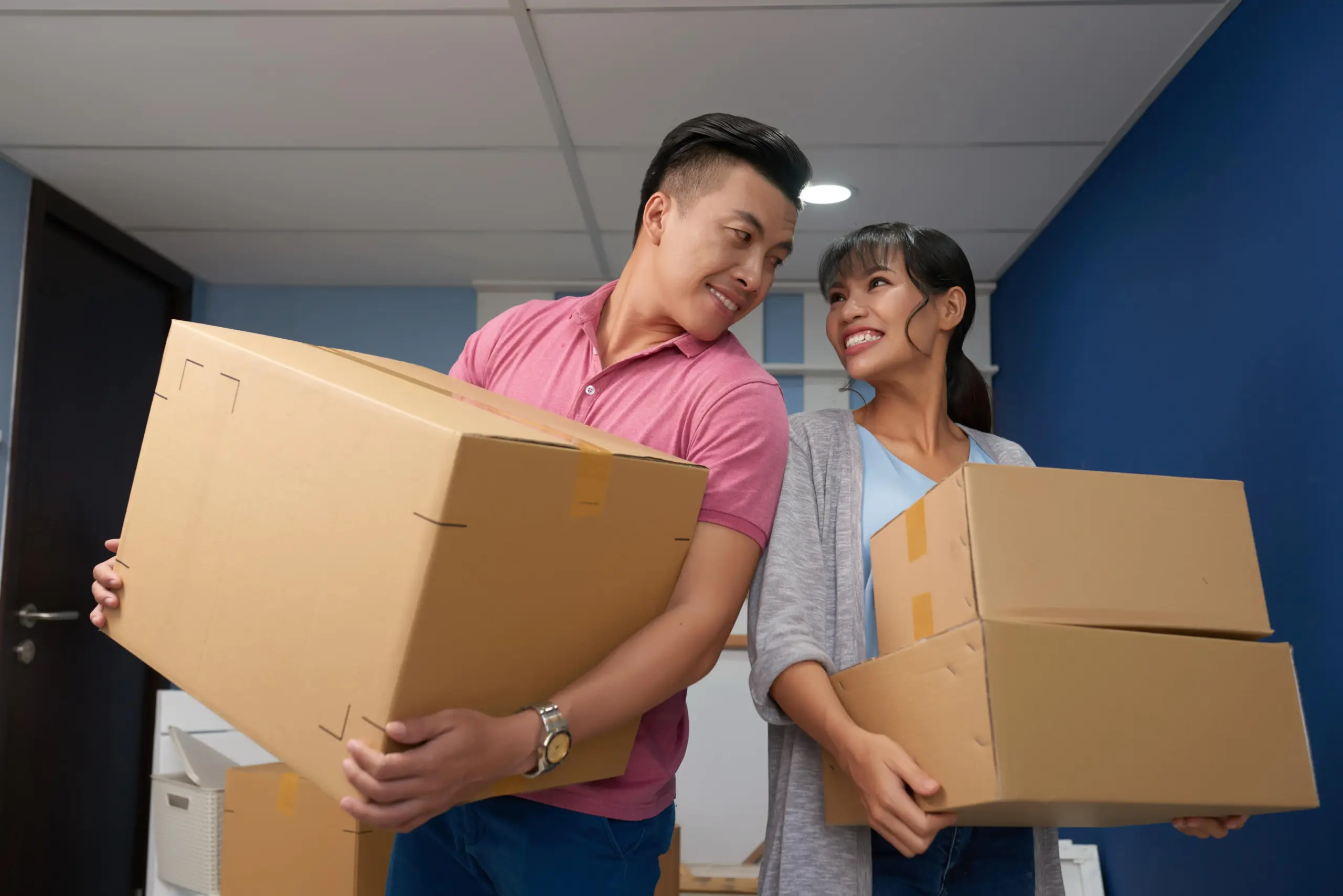 loving couple with moving boxes (1)
