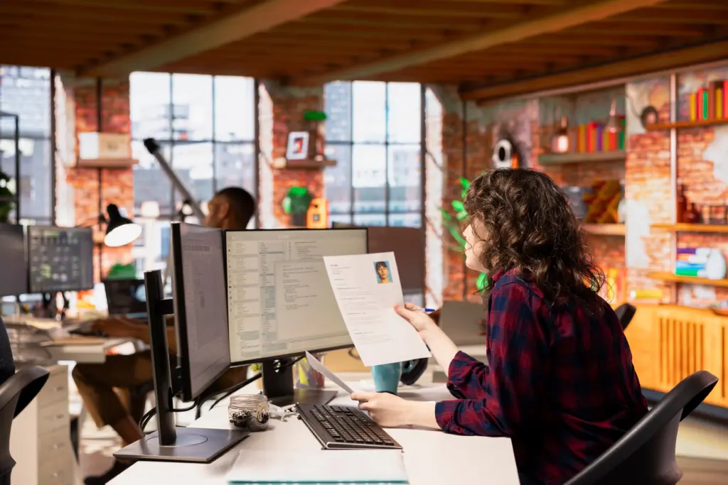 startup hr employer reading cvs software development position (1)