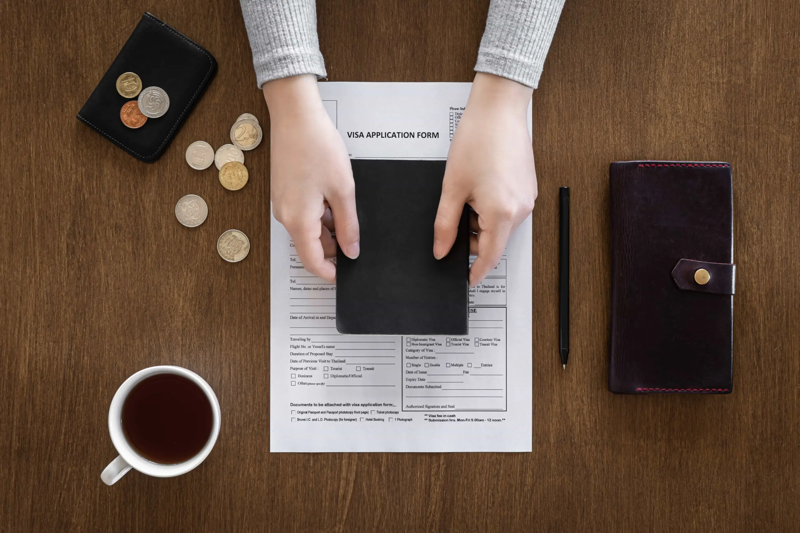 visa application form wooden table visa processing registration flat lay (1)