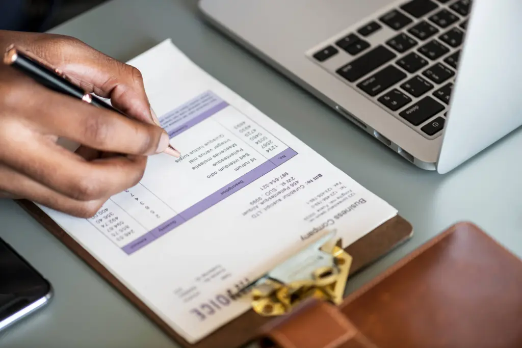 closeup business man checking tax invoice paper (1)