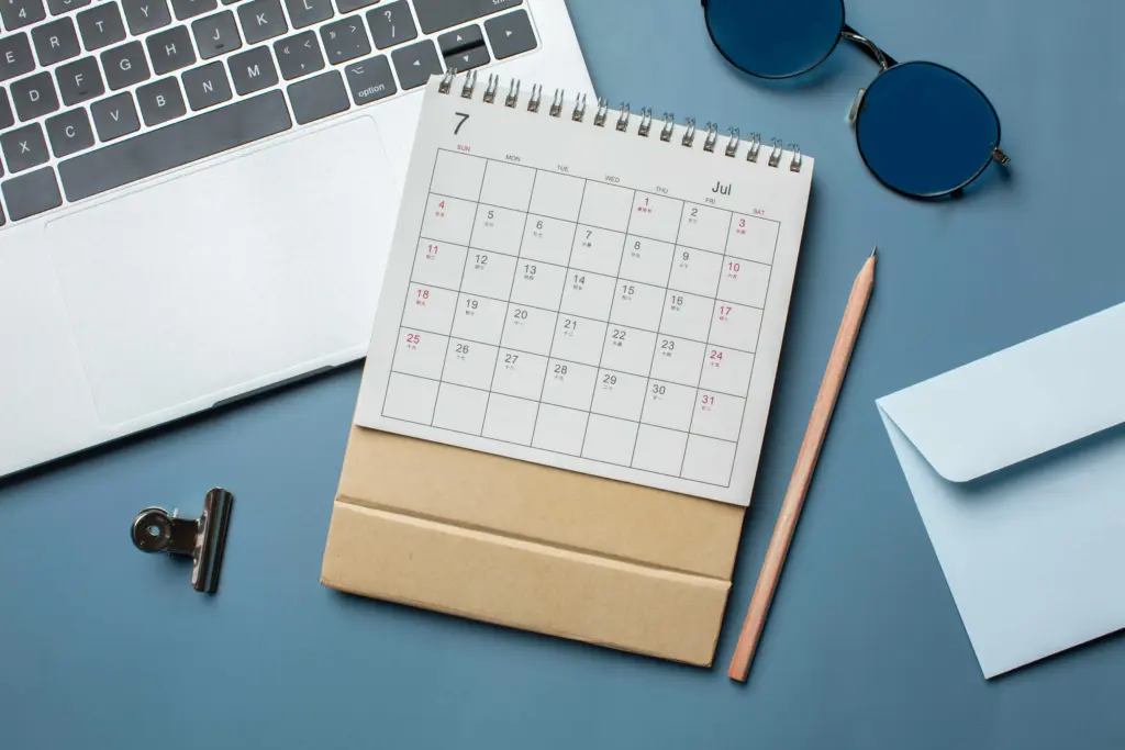 flat lay calendar laptop arrangement (1)